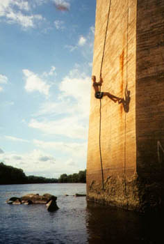 Jeremy climbing on an old bridge tower