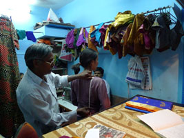 Joy gets measured at the tailor