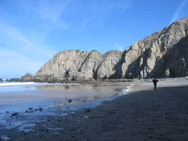 hurrying down the empty beach