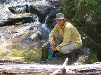 me pumping drinking water from a stream