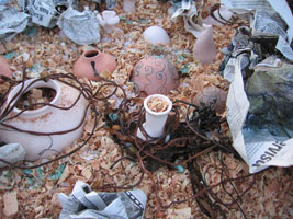 clay pots with wood shavings, rock salt, kelp, and copper oxide