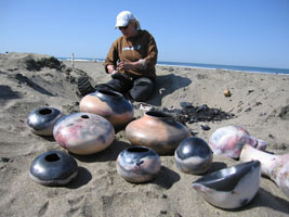 Debbie inspects a pot