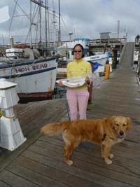 Joy with fish and Hinckley the dog