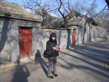 Joy walking through a hutong