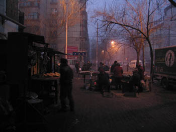 food vendors on a street corner, Urumqi