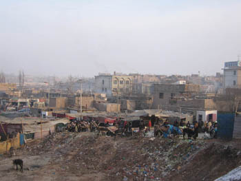rubbish dump and market stalls, Kashgar