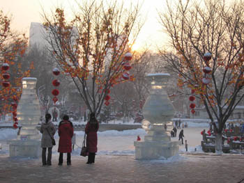 women looking at an ice rink, Urumqi