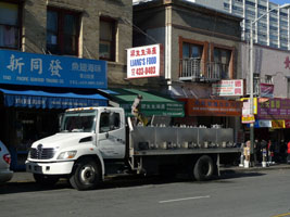 live fish delivery truck, man with net